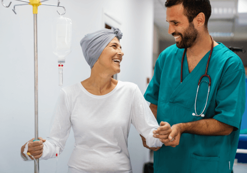 doctor walking with cancer patient