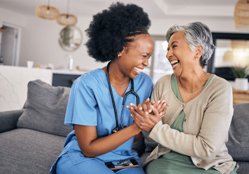 at home nurse sitting with patient